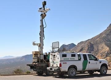 News vehicle with portable antenna in mountain country